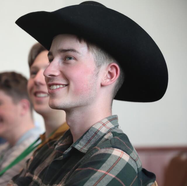 A side profile image of Brenden Fowler. He has brown eyes and wears a black cowboy hat.