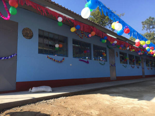 Exterior of blue school building in Guatemala