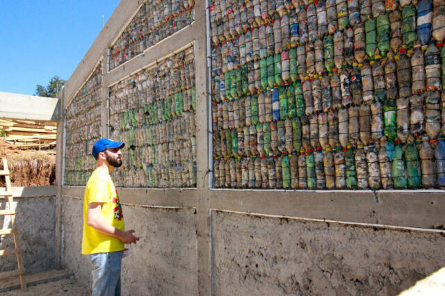 In-progress photo of construction of bottle school with eco-bricks