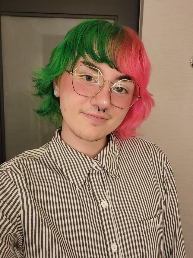 Code smiling at camera.