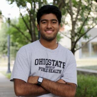 Abhinav smiling at camera.