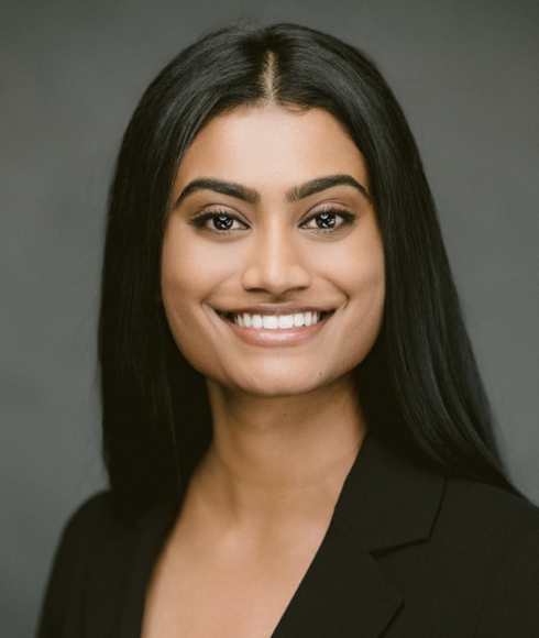 A smiling woman in a black jacket