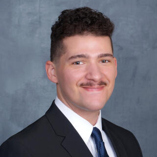 Cordell smiling at camera.