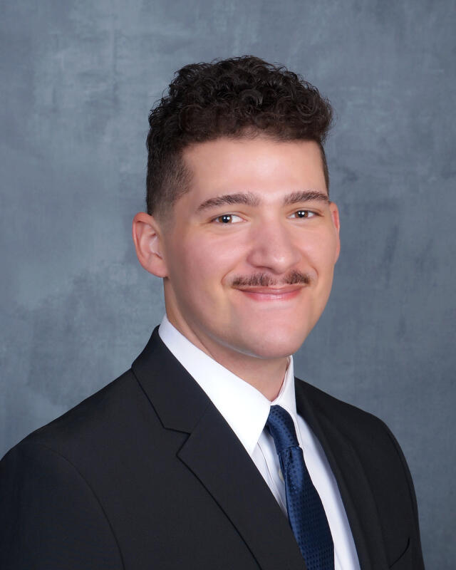 Cordell smiling at camera.