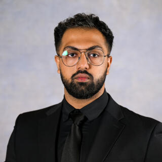 Waiz looking at camera.