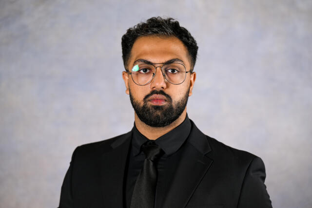 Waiz looking at camera.