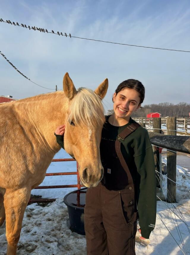 Daniela smiling with horse.