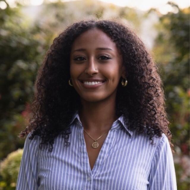 Millena smiling at the camera.