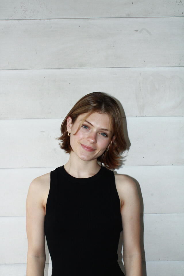 Olivia smiling at the camera.