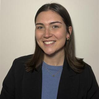 a professional image of Emma smiling.