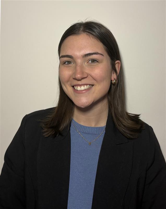 a professional image of Emma smiling.