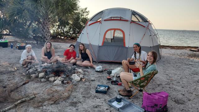 Buck-I-SERV alternative break participants and Florida Aquatics Preserves staff enjoy a bonfire