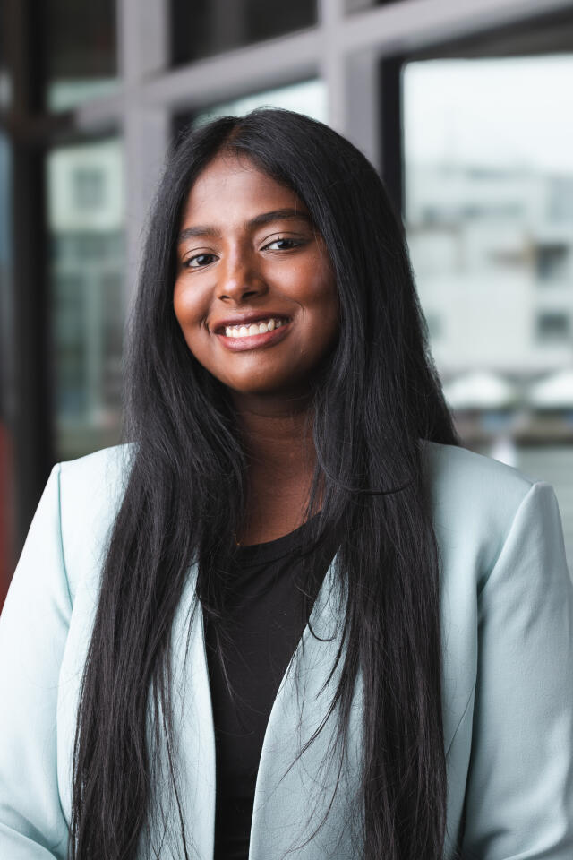Ahalya smiling at the camera.