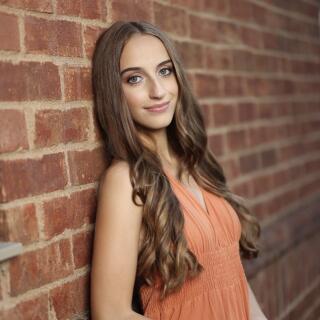 Sophia smiling at the camera.