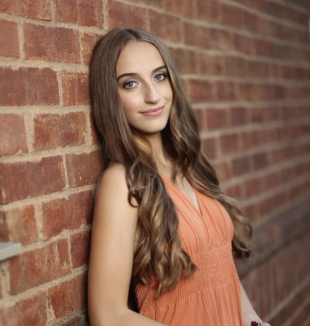 Sophia smiling at the camera.