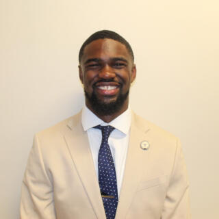 Isaac smiling at the camera.