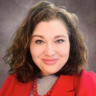 Kelly smiling at the camera.