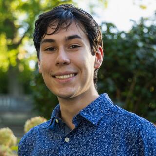 Mateo smiling at the camera.