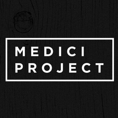 Medici Project written in white text and surrounded by white rectangle on plain black background