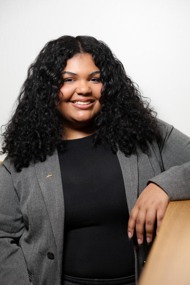 Emma smiling at the camera.