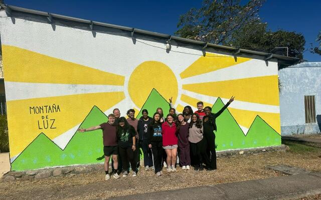 A group picture in front of Montana De Luz in Honduras