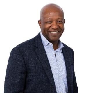 Robert smiling at the camera.