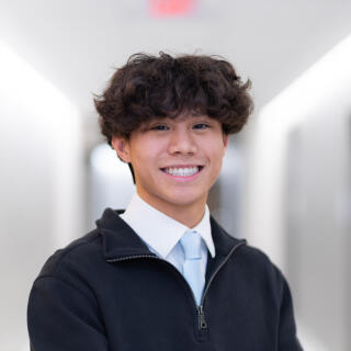 Chris smiling at the camera.